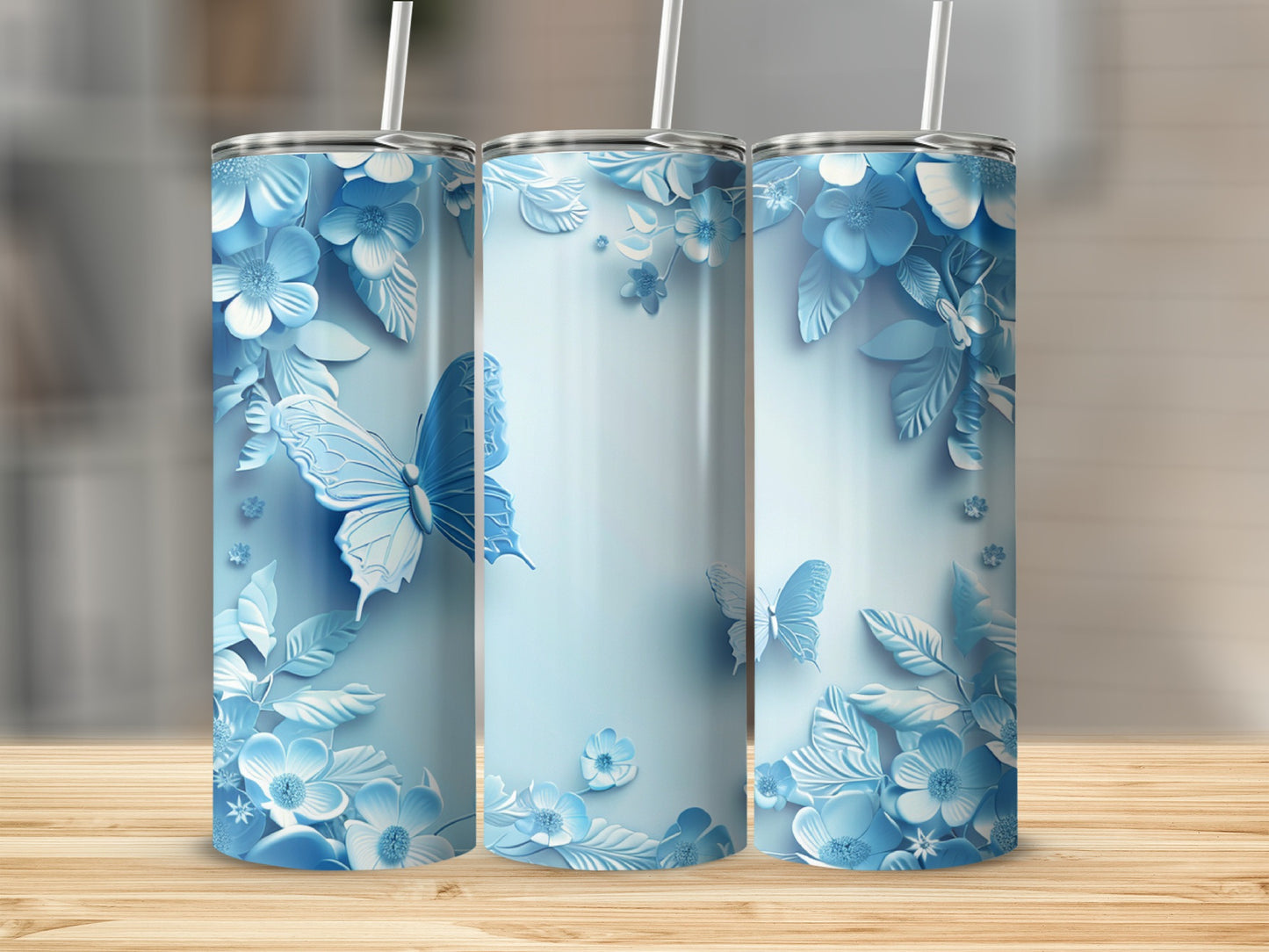 Light blue tumbler with white butterflies and floral design.
