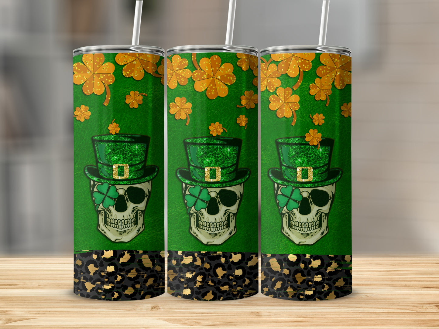 Three green tumblers with skull, shamrocks, and leopard print.