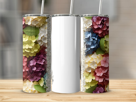 Three tumblers with floral designs and a blank white tumbler.
