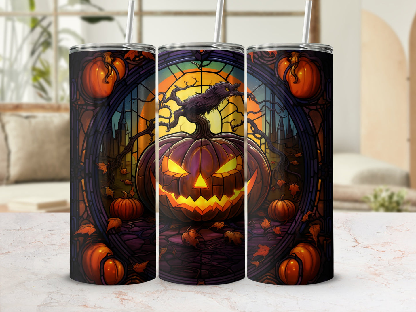 Three Halloween tumblers with jack-o'-lantern and spooky tree designs.