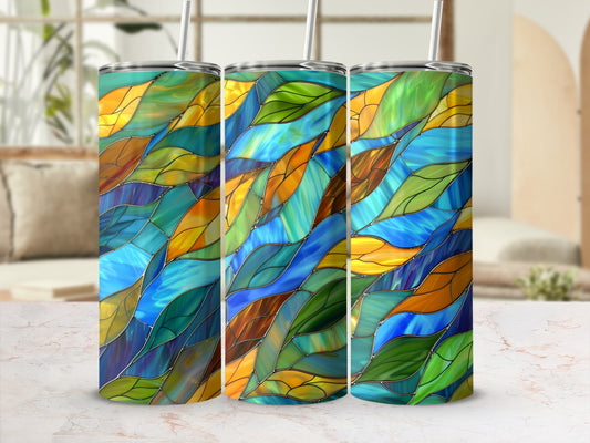 Tumbler with a stained glass pattern in blue, green, and gold hues.