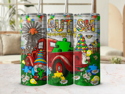 Tumbler with "Autism Awareness Day" text, gnome, windmill, and puzzle pieces.