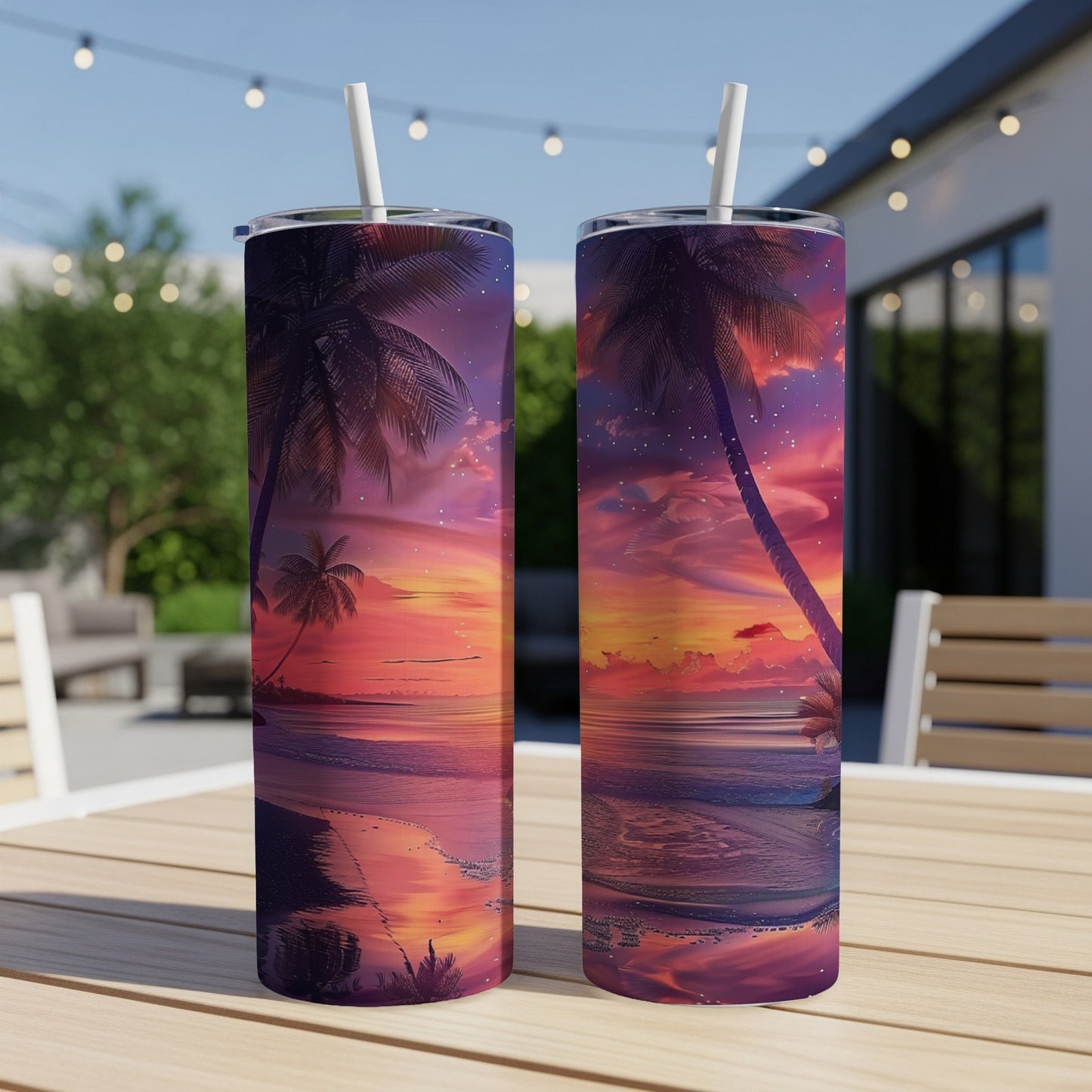 Two tall tumblers with a vibrant tropical sunset beach scene.