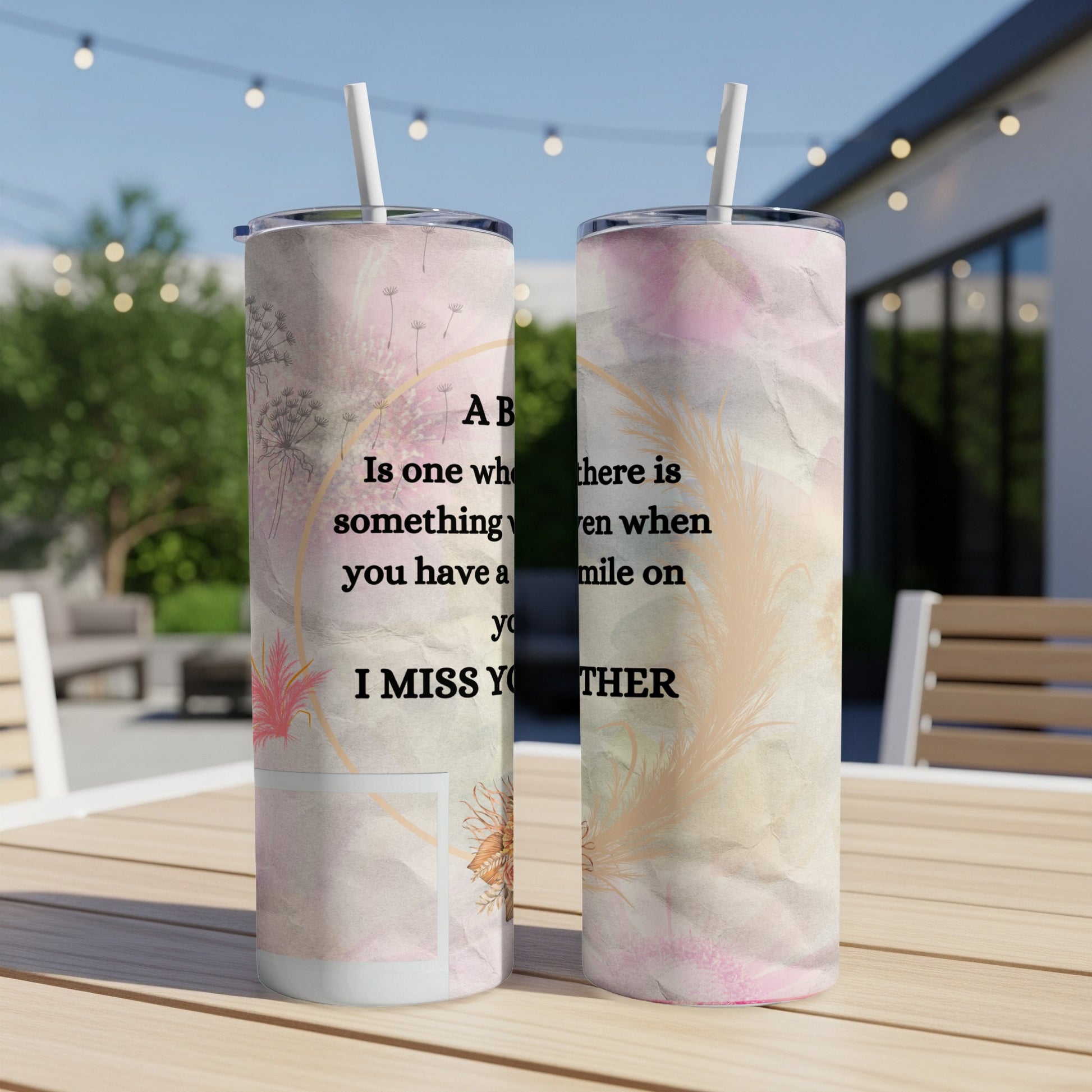 Tumbler with feather and floral design, text "I MISS YOU THERE".