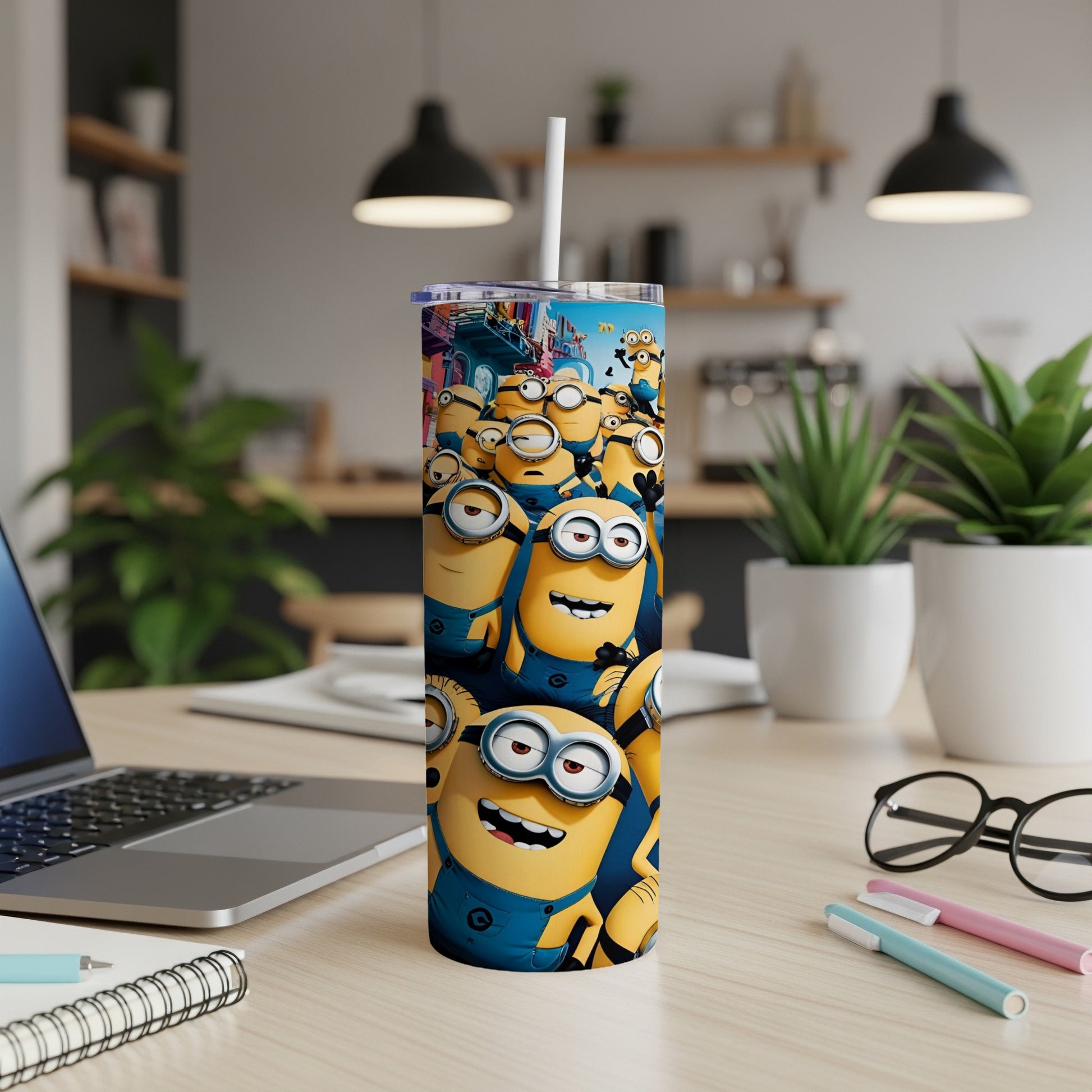 Minions characters on a tall cylindrical tumbler with a white straw.