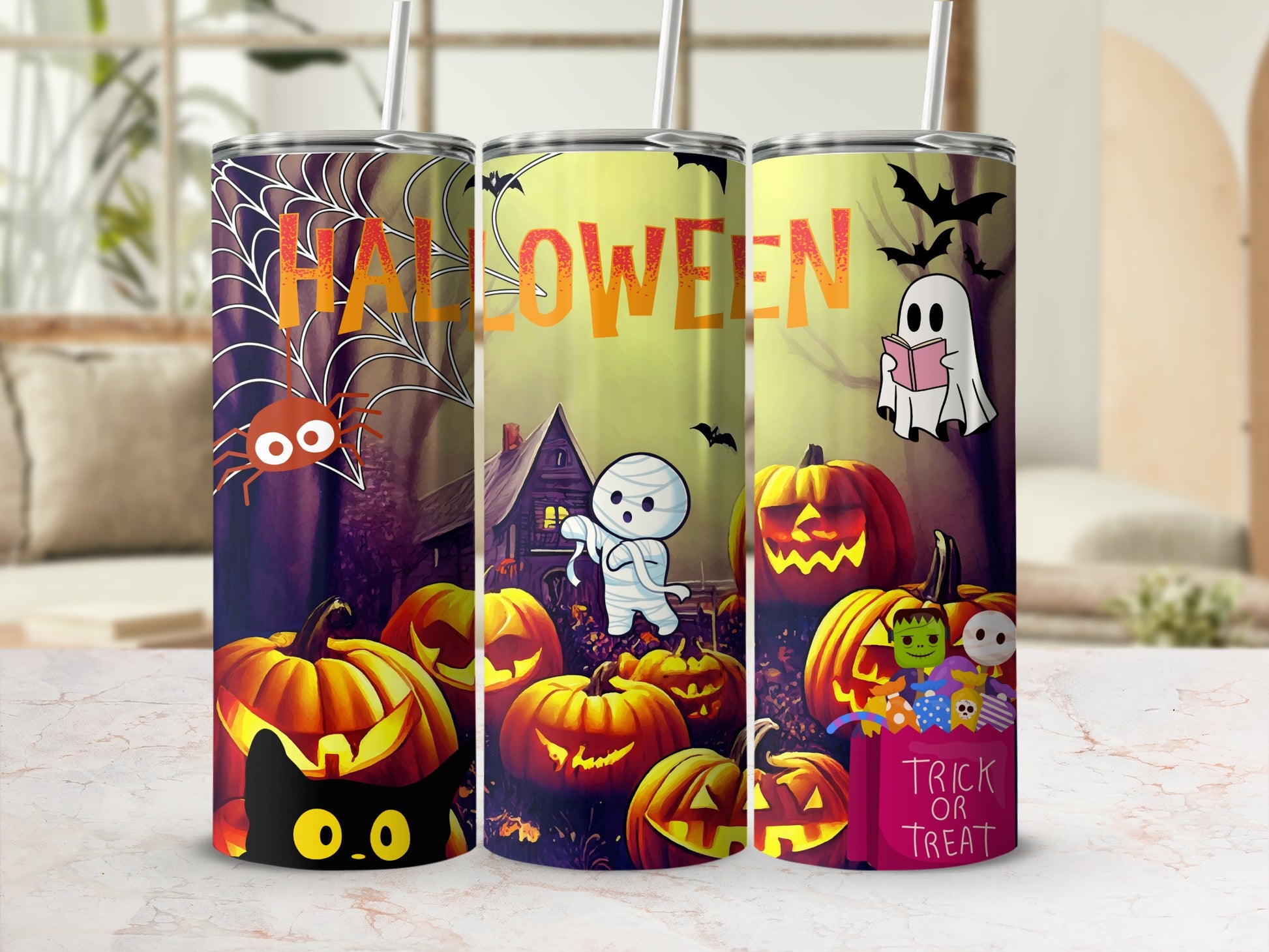 Three Halloween-themed tumblers with pumpkins, ghosts, bats, spider, and a black cat.