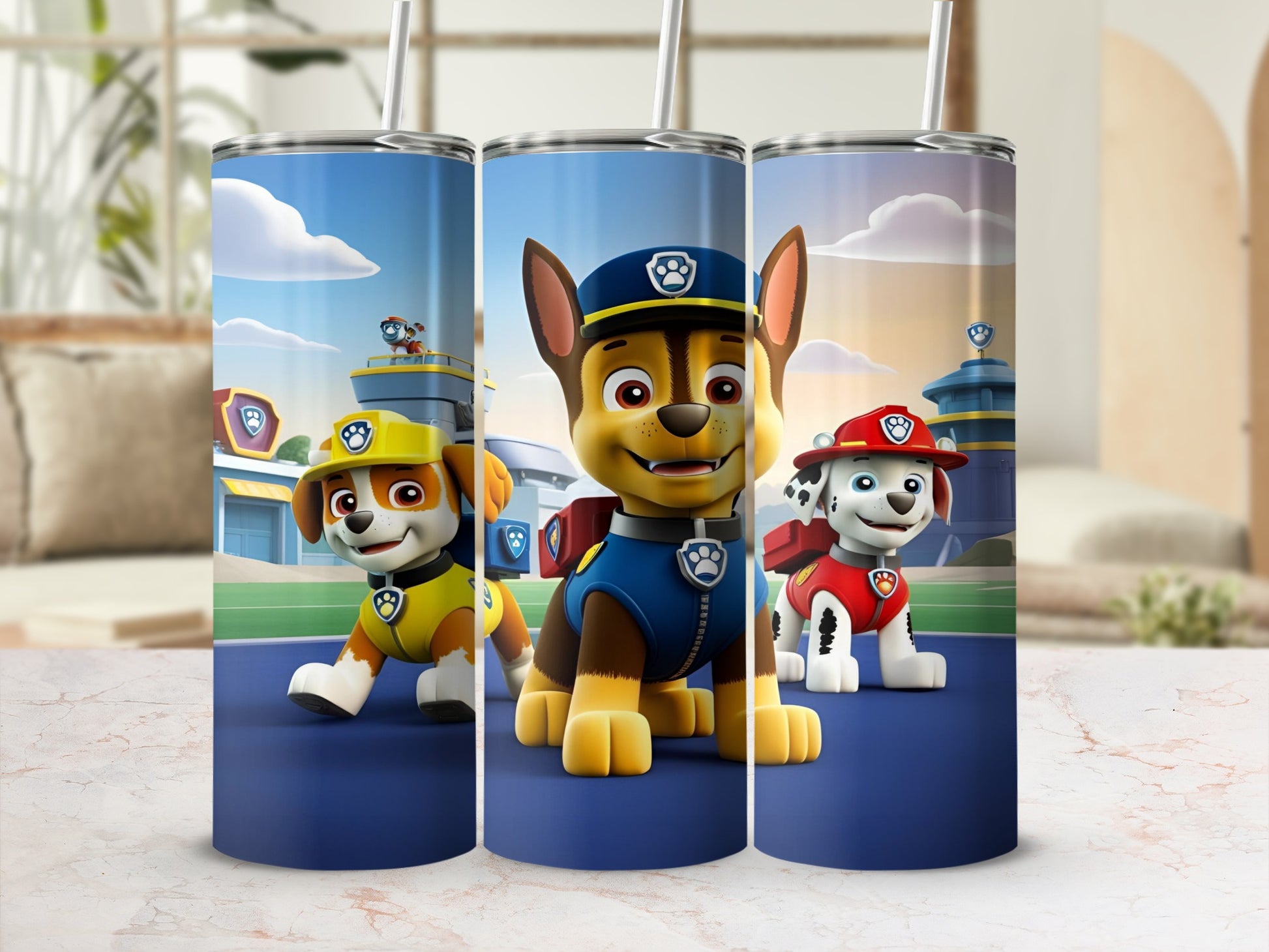 Paw Patrol characters Chase, Marshall, and Rubble on a blue tumbler.