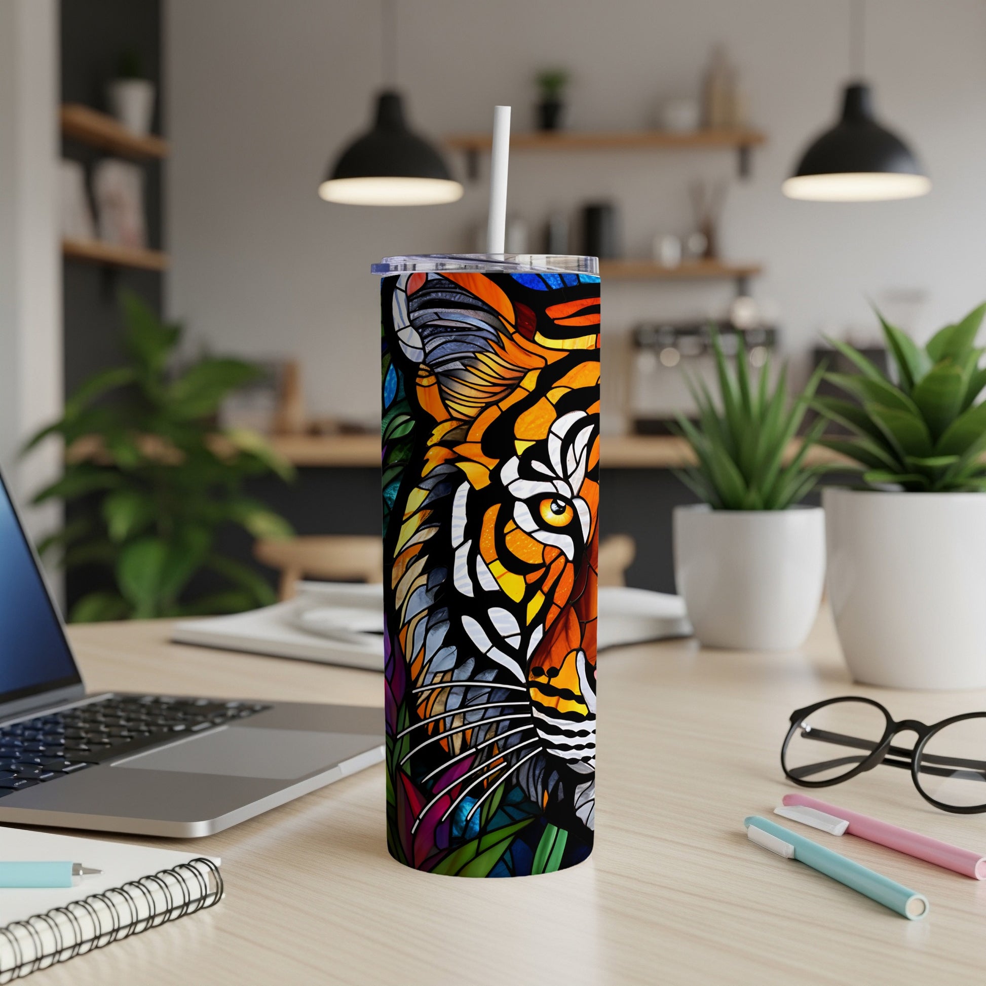 Colorful stained-glass style tiger face on a stainless steel tumbler.