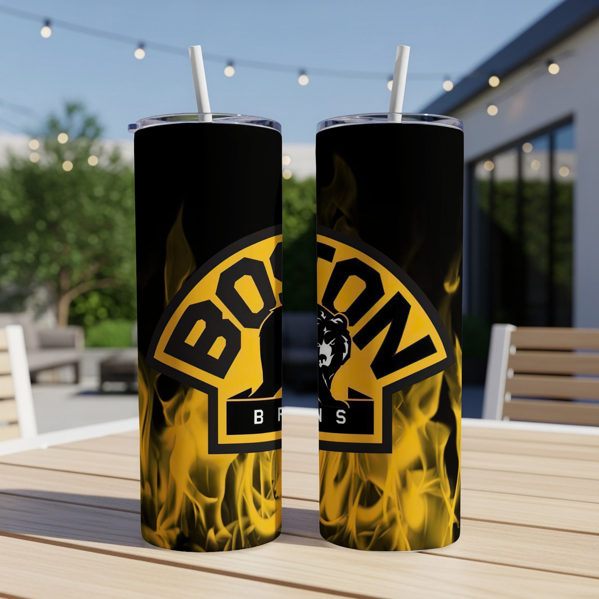Boston Bruins logo with flaming design on two stainless steel tumblers with straws.