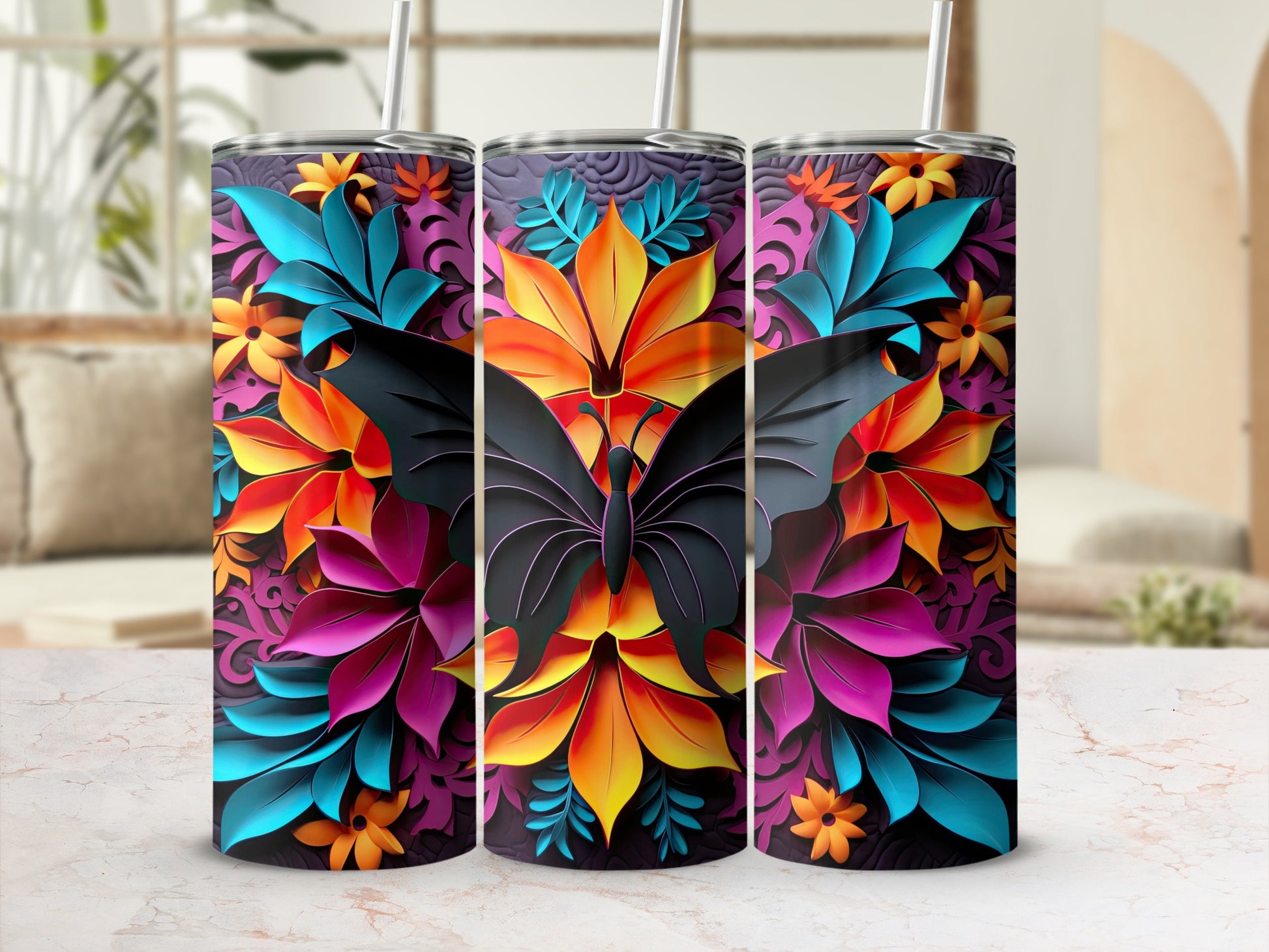 Three tumblers with a dark butterfly and vibrant floral pattern.