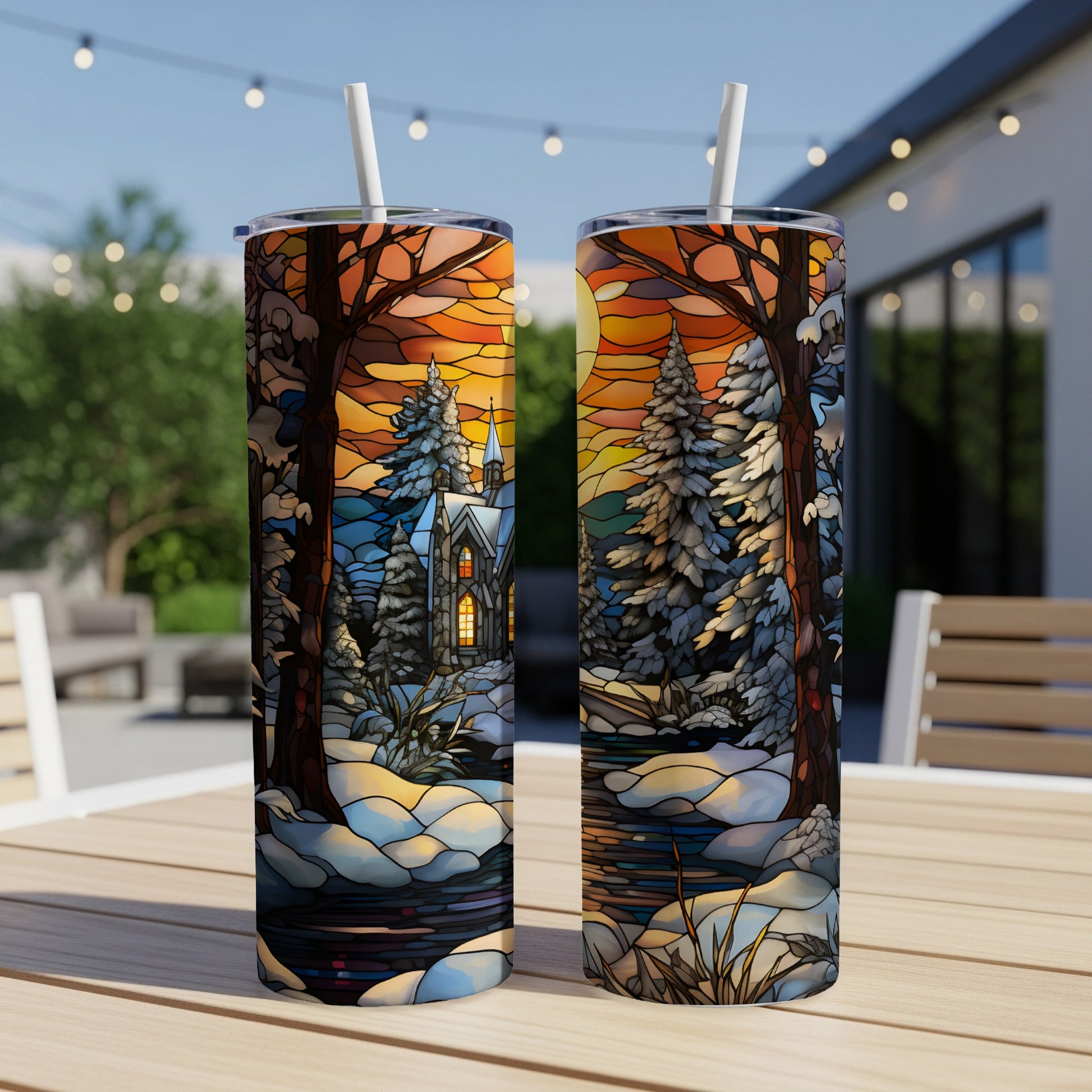 Two tumblers with a winter scene featuring a church, trees, and sunset.