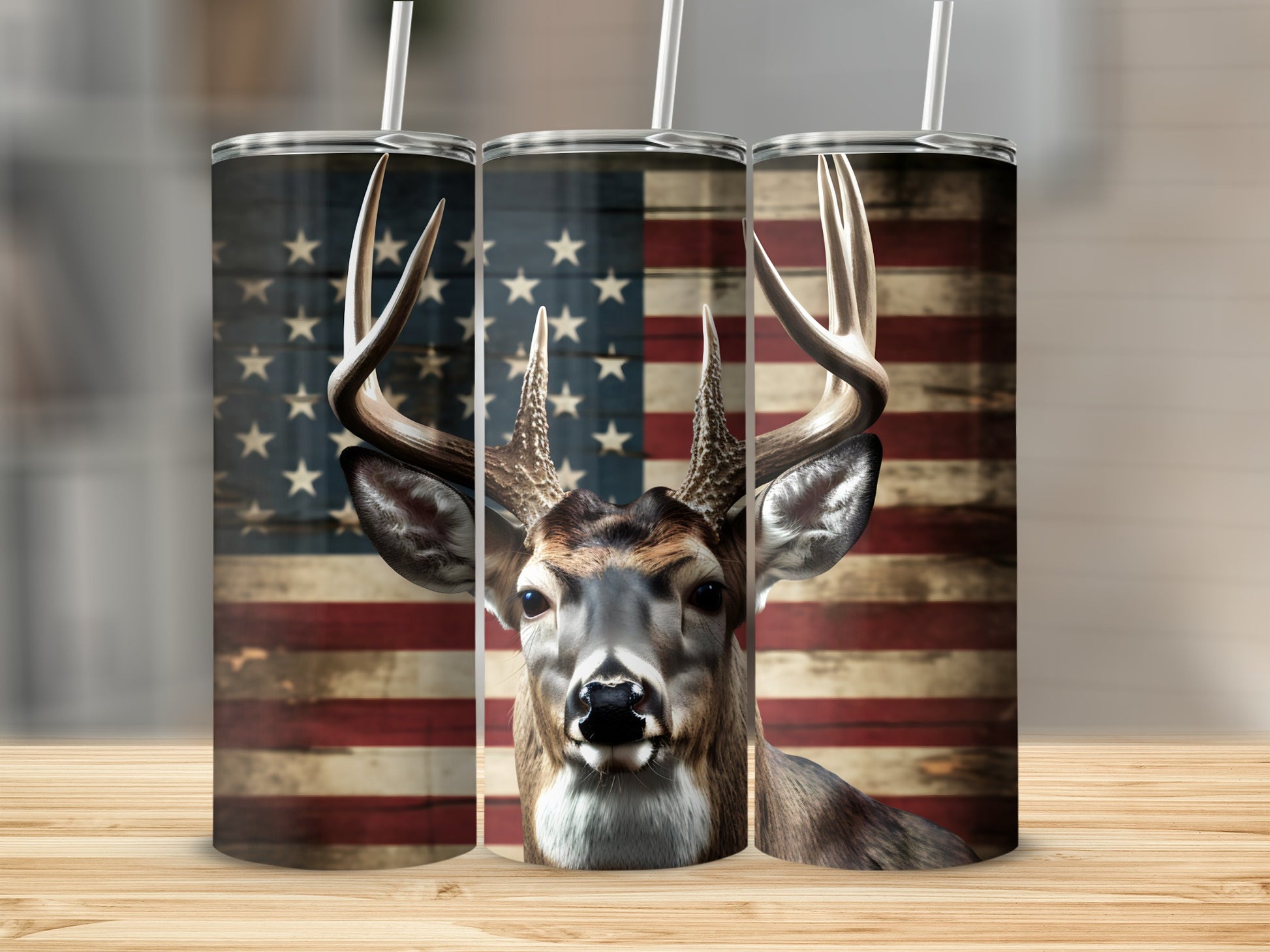 Deer head with American flag background on three tumblers.