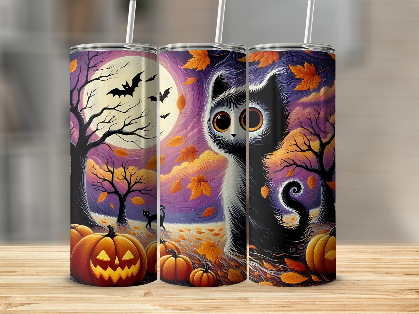 Three tumblers with a Halloween theme featuring a black cat, pumpkins, bats, and autumn leaves.