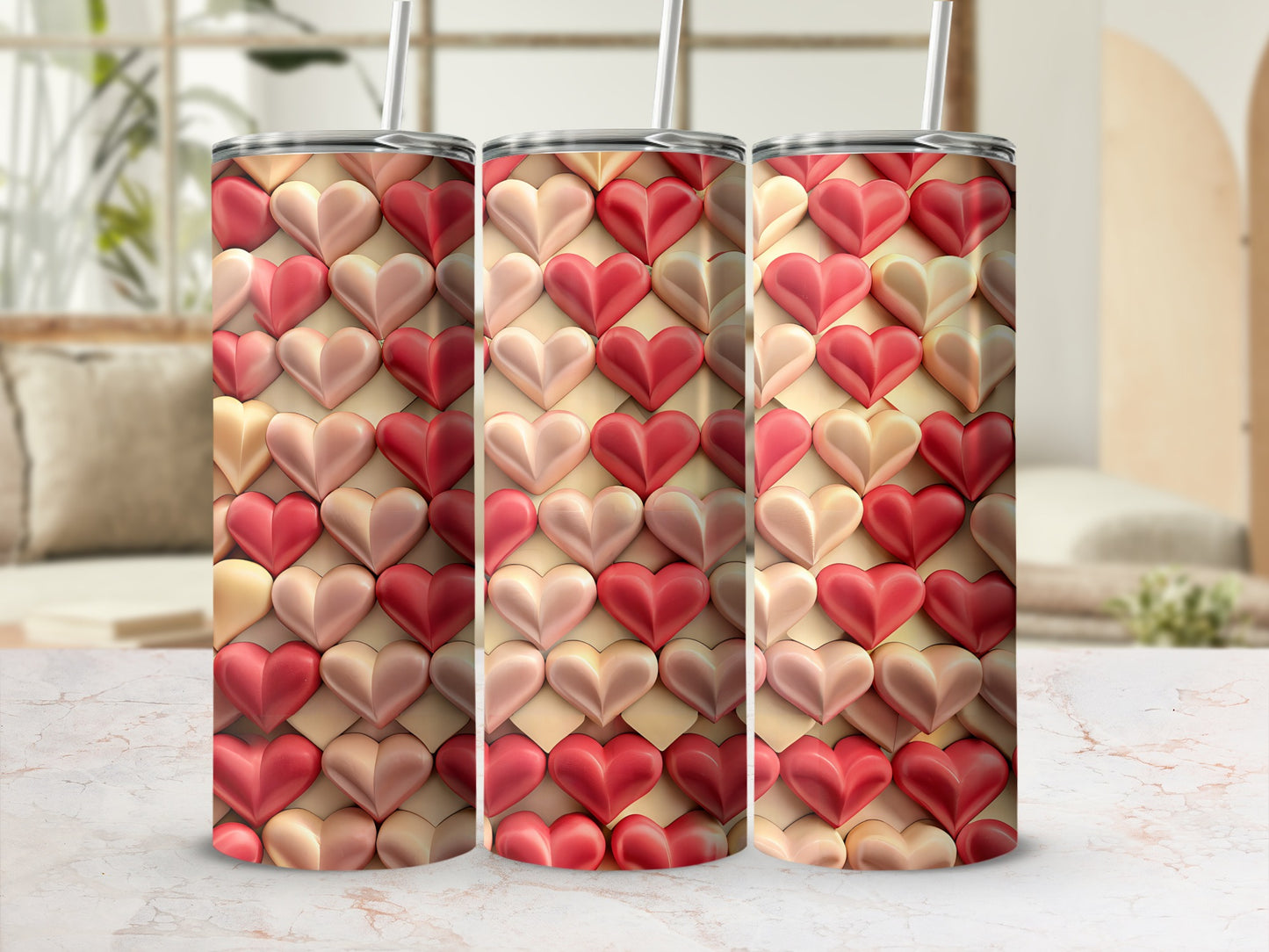 Three tumblers with a textured heart pattern in shades of pink and red.