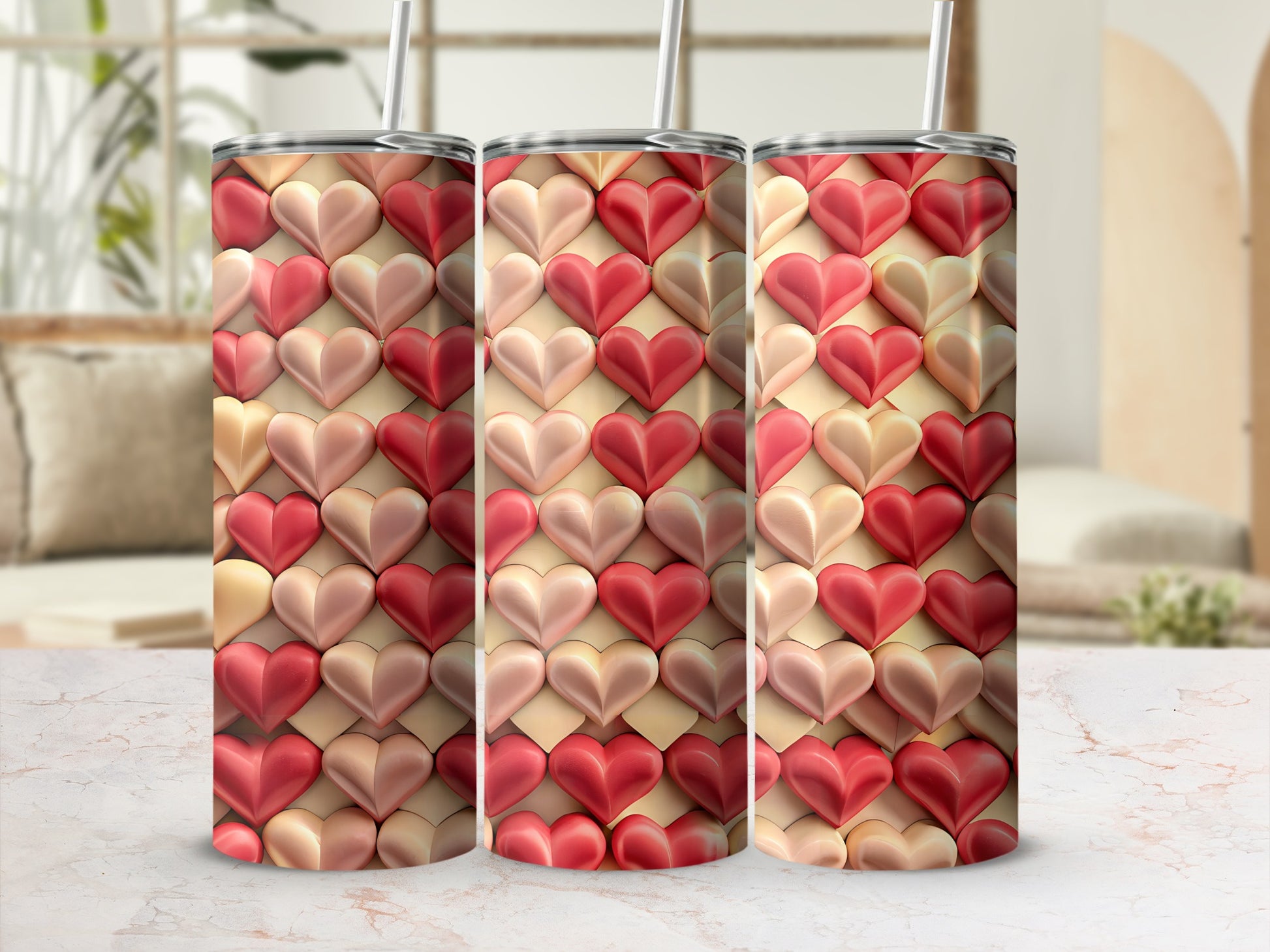 Three tumblers with a textured heart pattern in shades of pink and red.