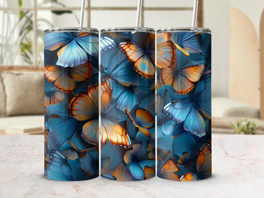 Triptych of tumblers with blue and orange butterfly patterns.