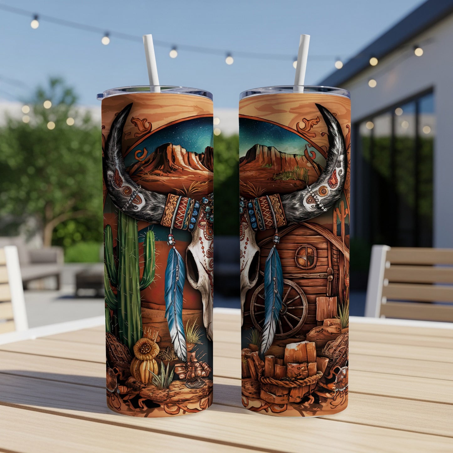 Two tumblers with a western landscape featuring a bull skull, cactus, and cabin.