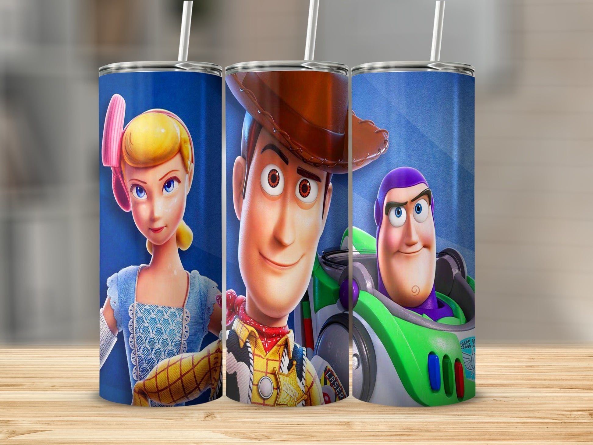 Bo Peep, Woody, and Buzz Lightyear characters on blue patterned tumbler with straw.