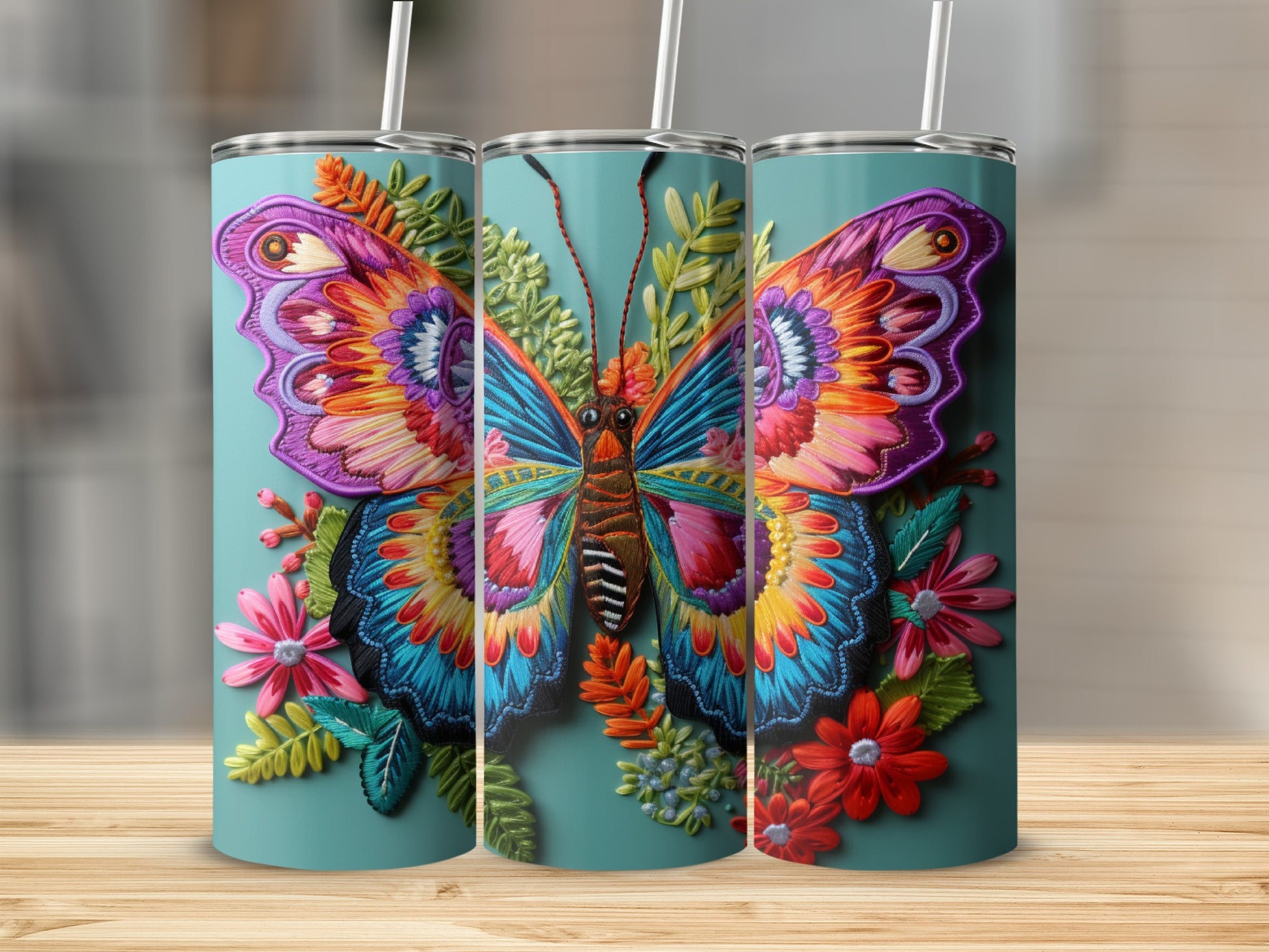 Three tumblers featuring a colorful, detailed butterfly and floral design.