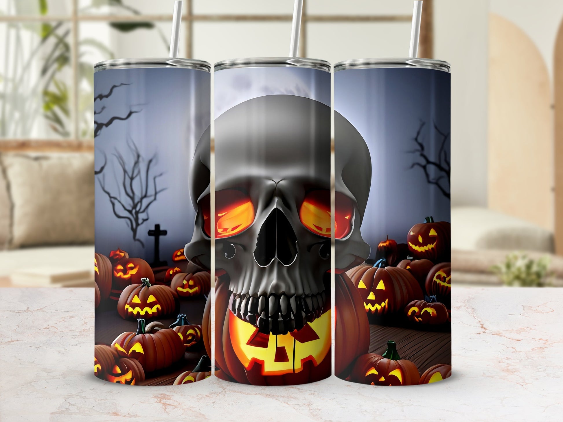 Skull and jack-o'-lantern Halloween graphic on three tumblers.