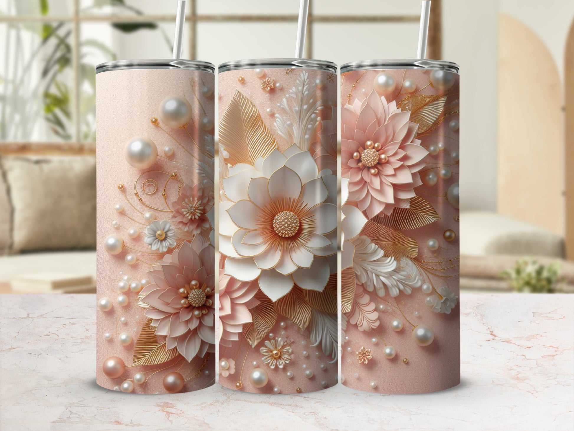 Three pink tumblers with floral and pearl embellishments.
