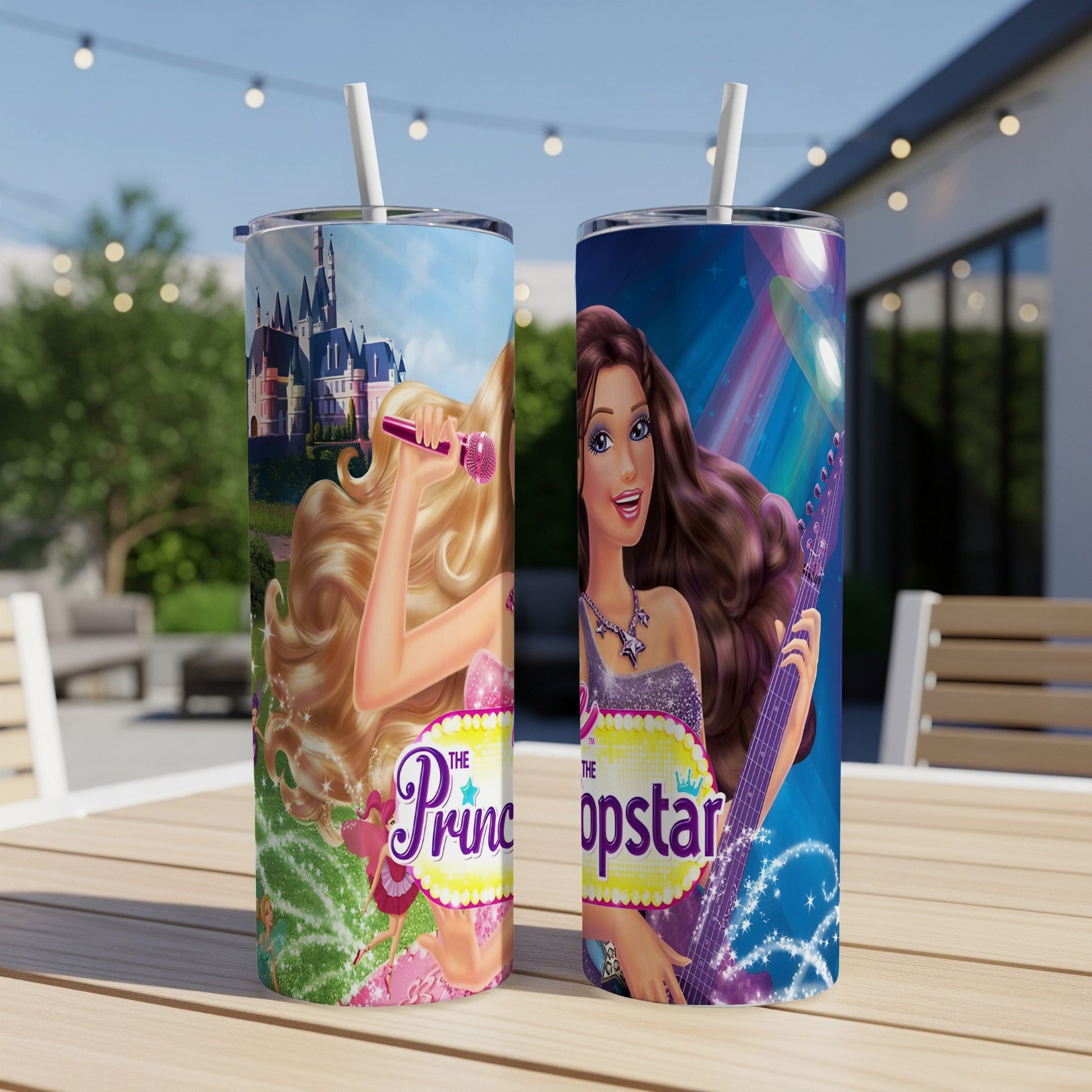 Two Barbie "The Popstar" tumblers with microphones and guitars on a table.