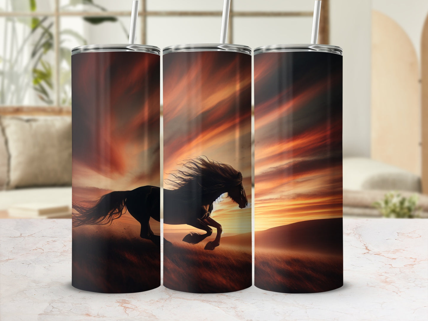 Three tumblers with a galloping horse against a fiery sunset.