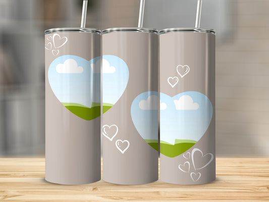 Three taupe tumblers with heart designs and sky landscape scenes.