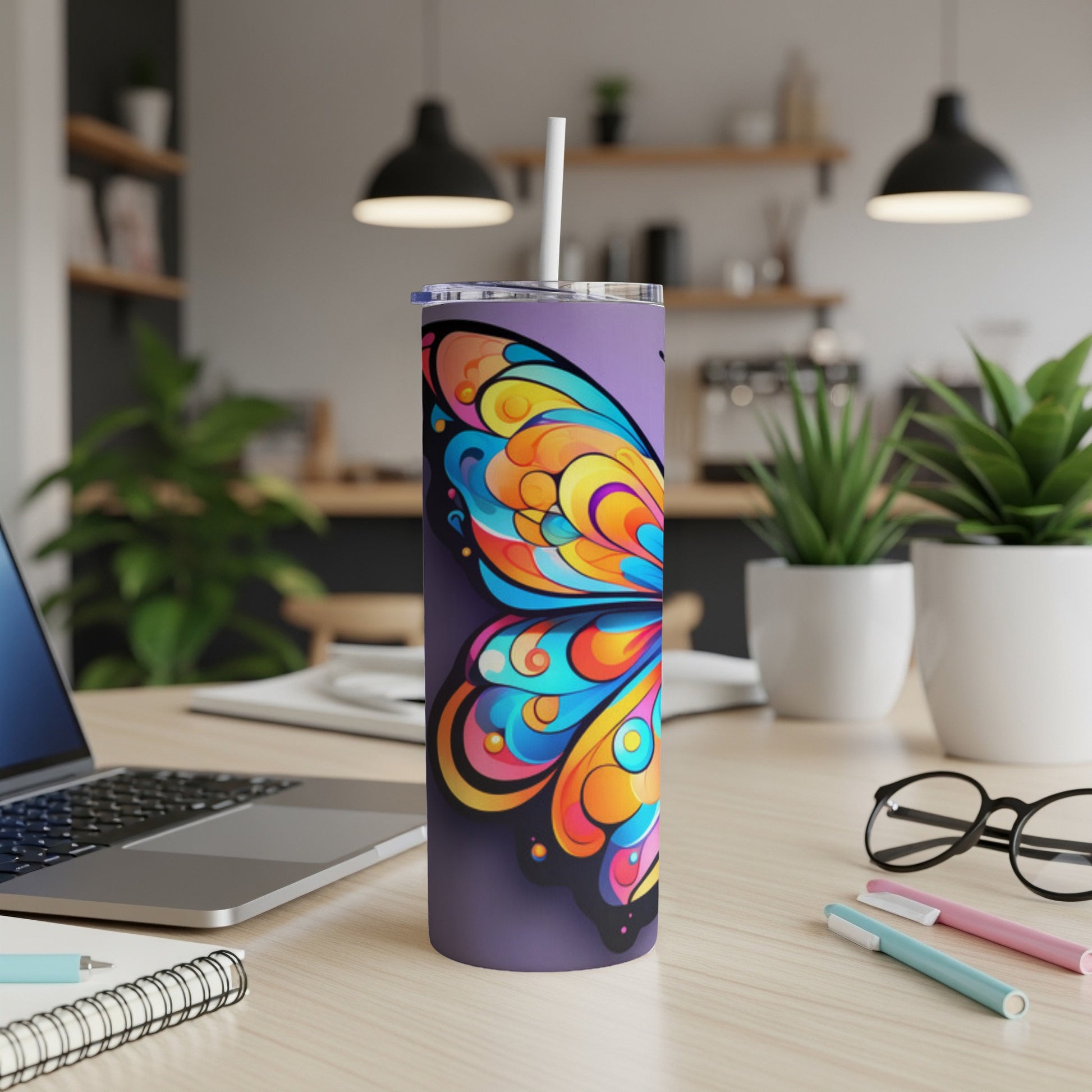 Purple tumbler with a colorful butterfly wing design.