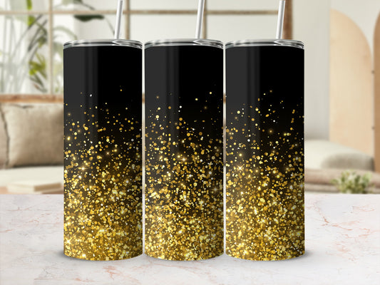 Three black tumblers with a gold glitter gradient, standing on a marble surface.