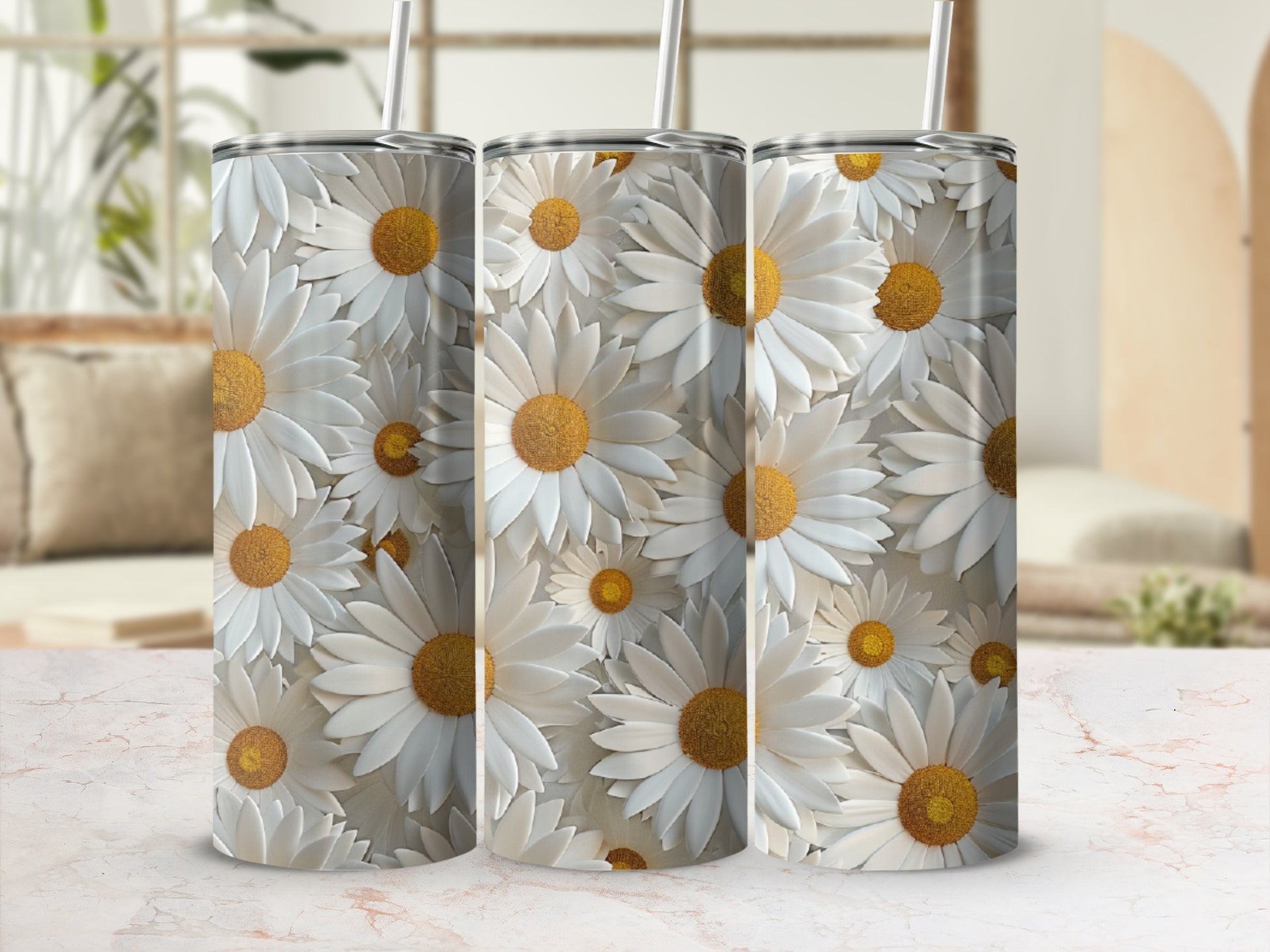 Three tall, white tumblers covered in a daisy floral pattern.