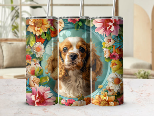 Three stainless steel tumblers featuring a Cavalier King Charles Spaniel surrounded by floral designs.