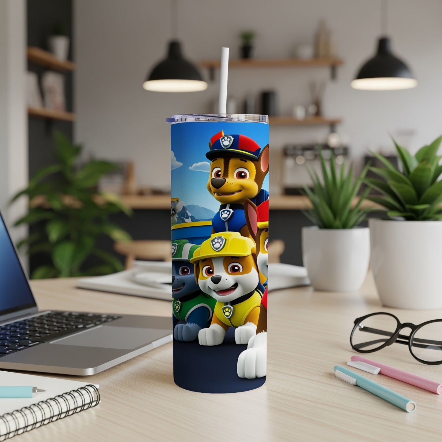 Paw Patrol characters Ryder, Chase, Marshall, and Rubble on a blue tumbler.