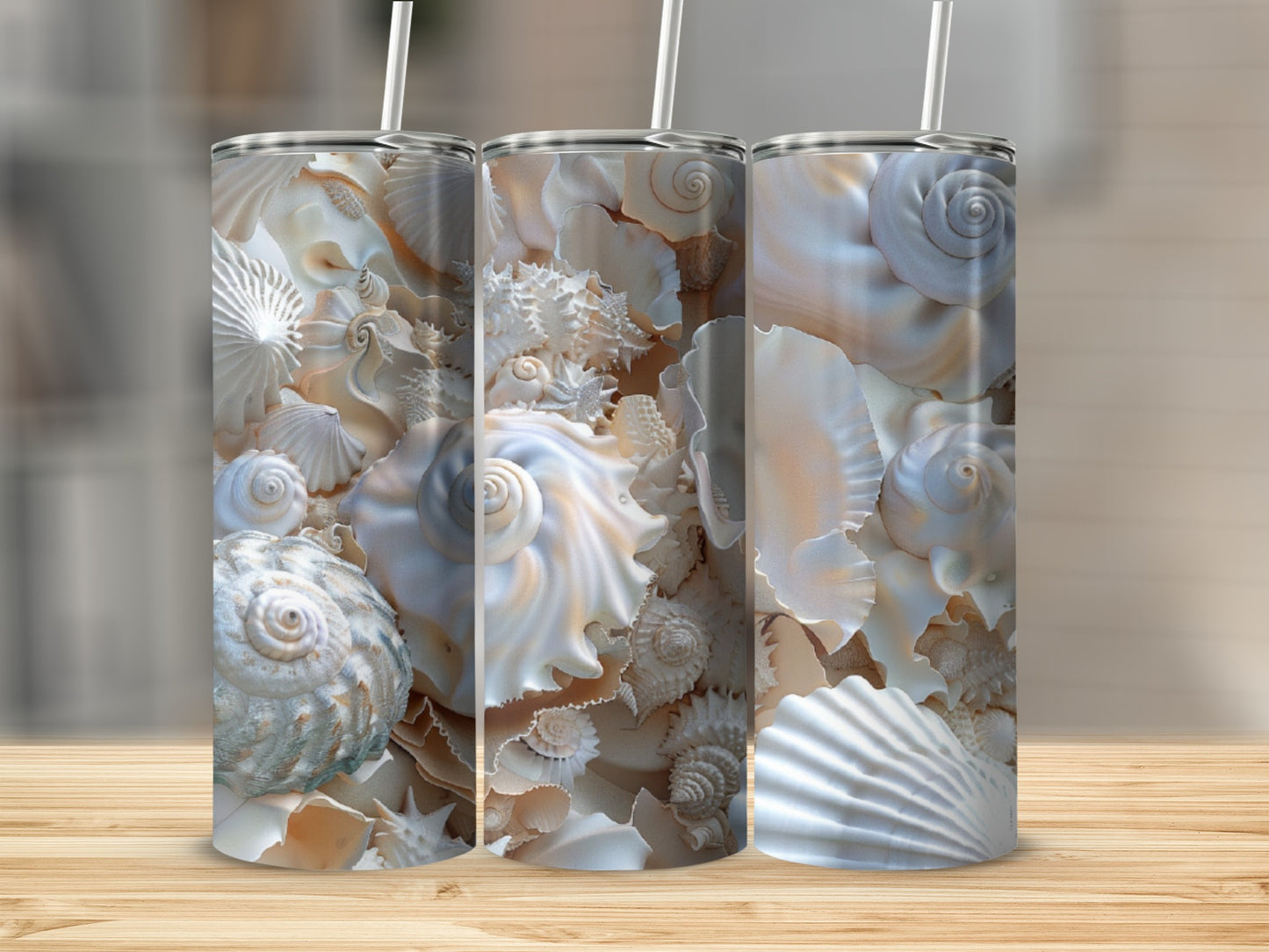 Three tumblers adorned with detailed seashell patterns.