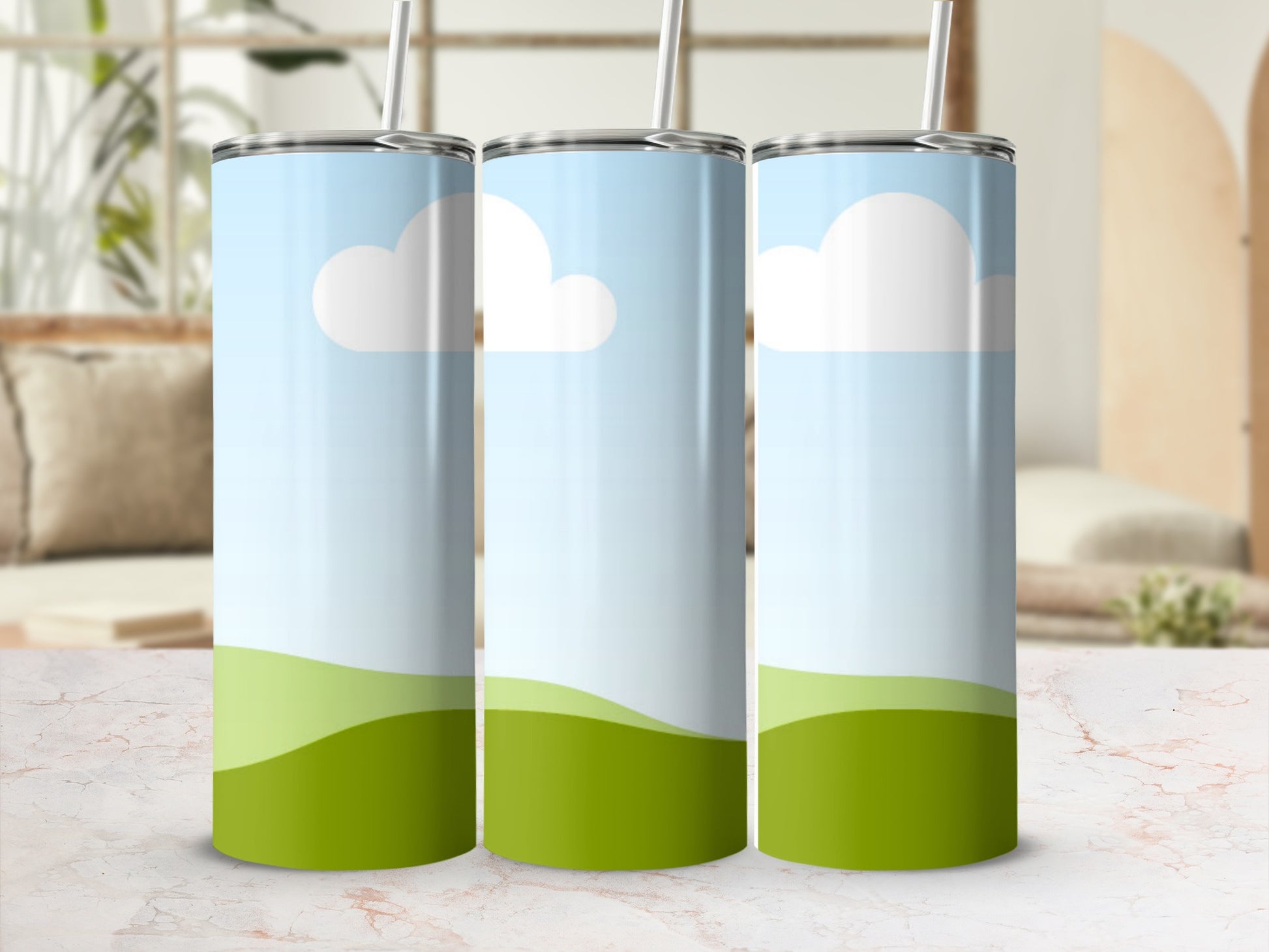 Three tumblers with a sky and rolling green hills design.