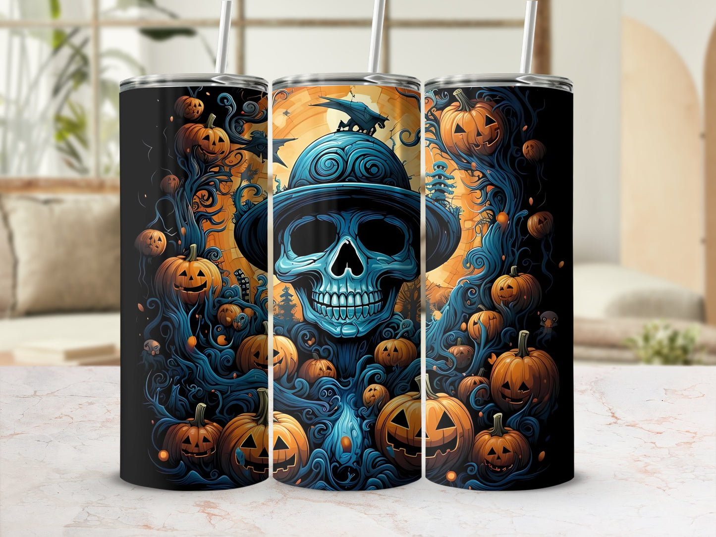 Three tumblers with a spooky Halloween design featuring a blue skull and pumpkins.
