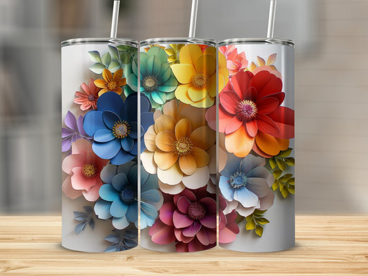 Three tumblers with vibrant, colorful floral patterns arranged artfully.