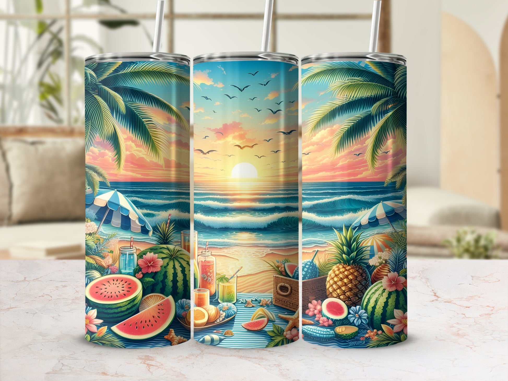 Three tumblers with a beach sunset design and fruit accents.