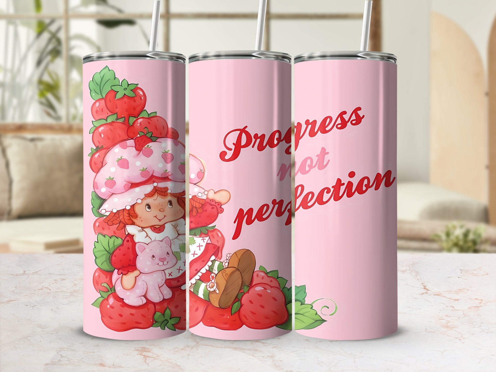Strawberry Shortcake character and strawberries on pink tumbler with text "Progress not perfection".