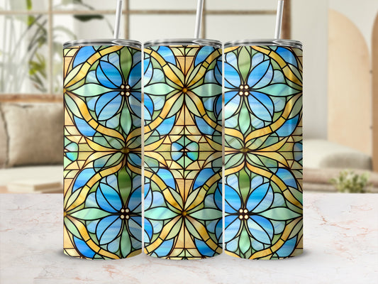 Three stained glass tumblers with floral blue and green patterns.
