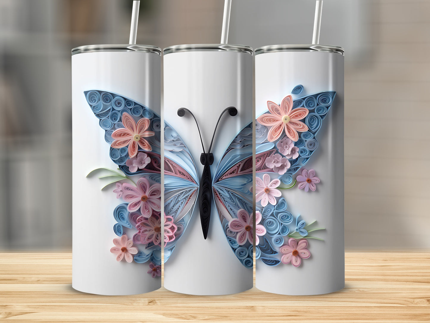 Three white tumblers with a quilled butterfly and floral design.