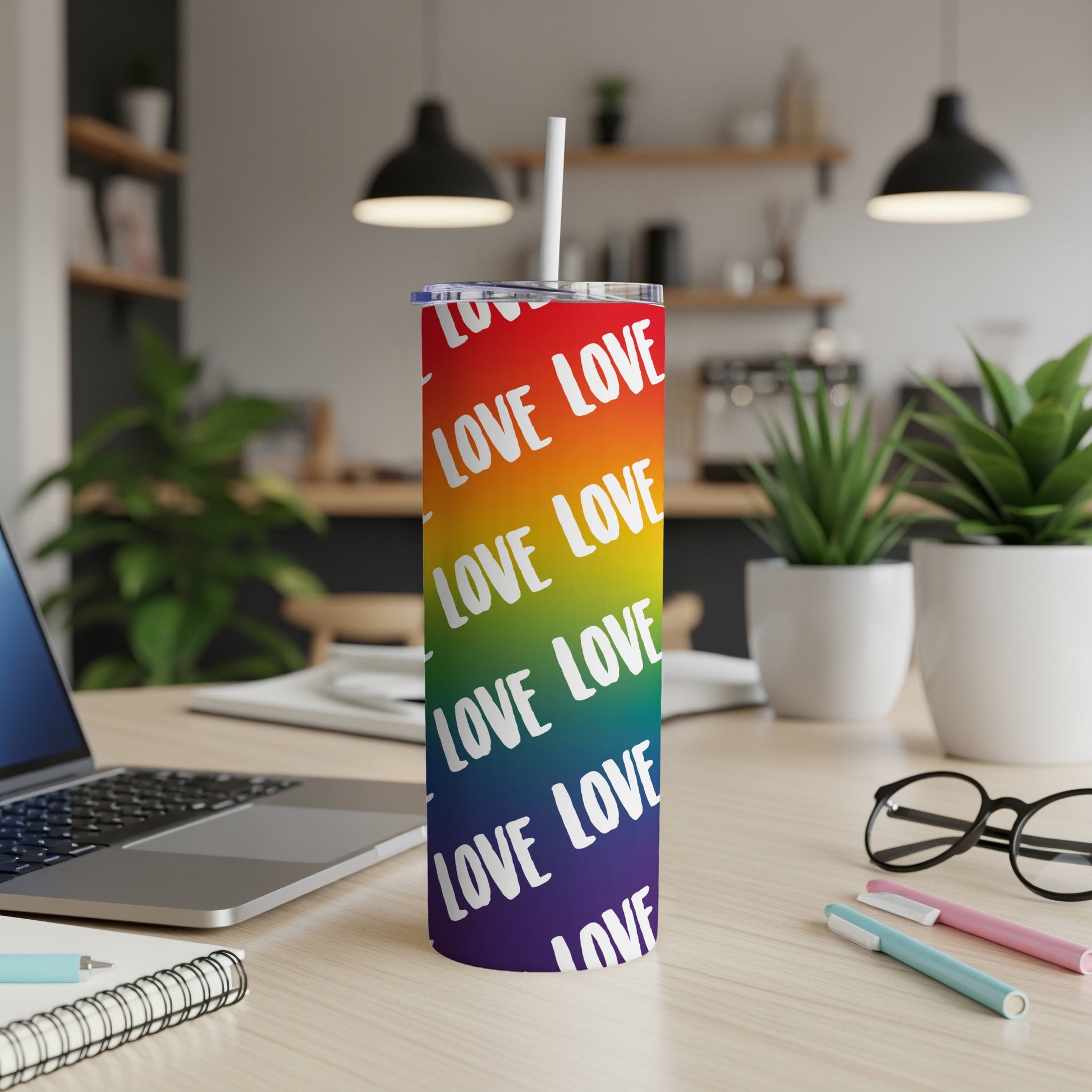 Rainbow gradient tumbler with "LOVE" repeated in white text.