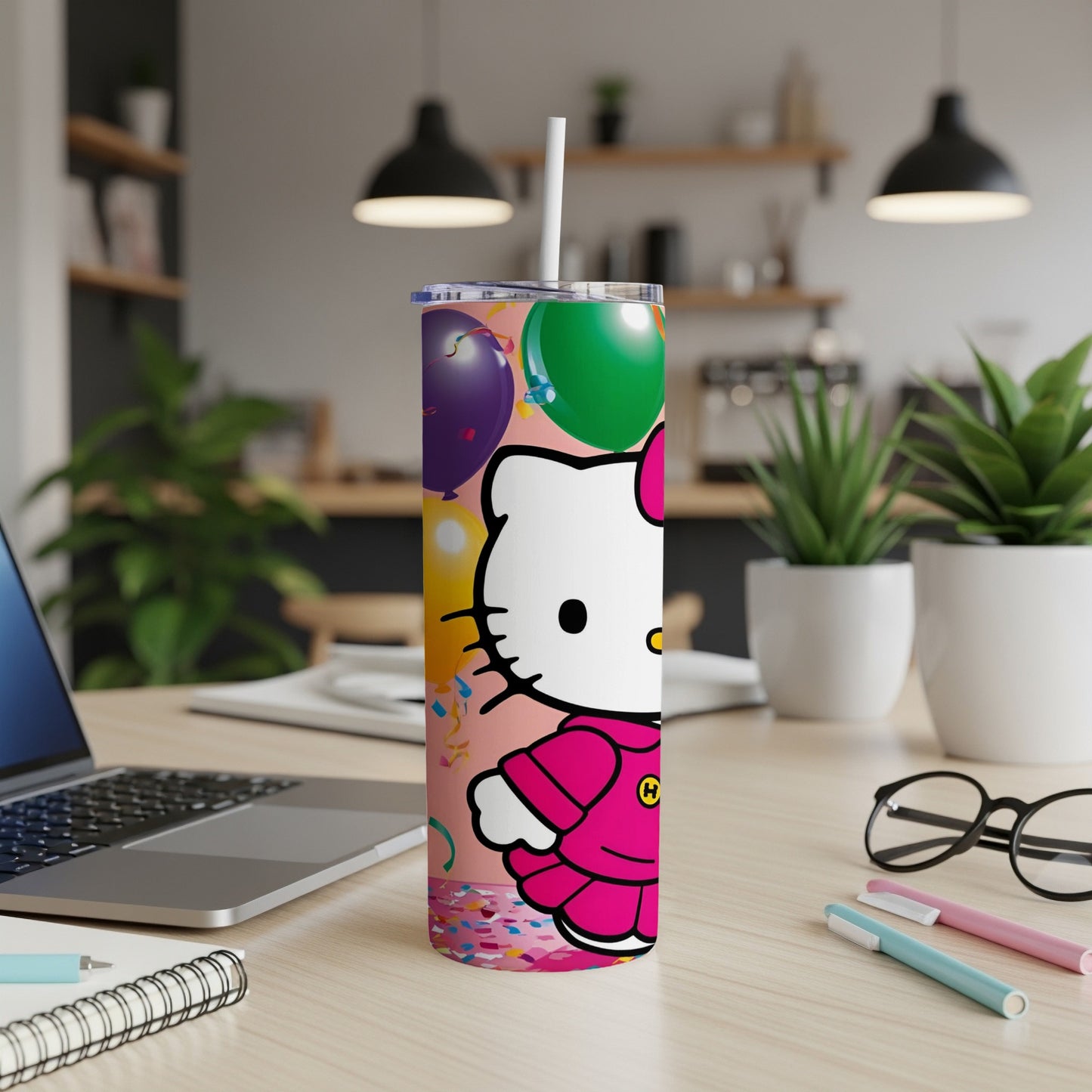 Hello Kitty tumbler with pink outfit, balloons, and confetti.