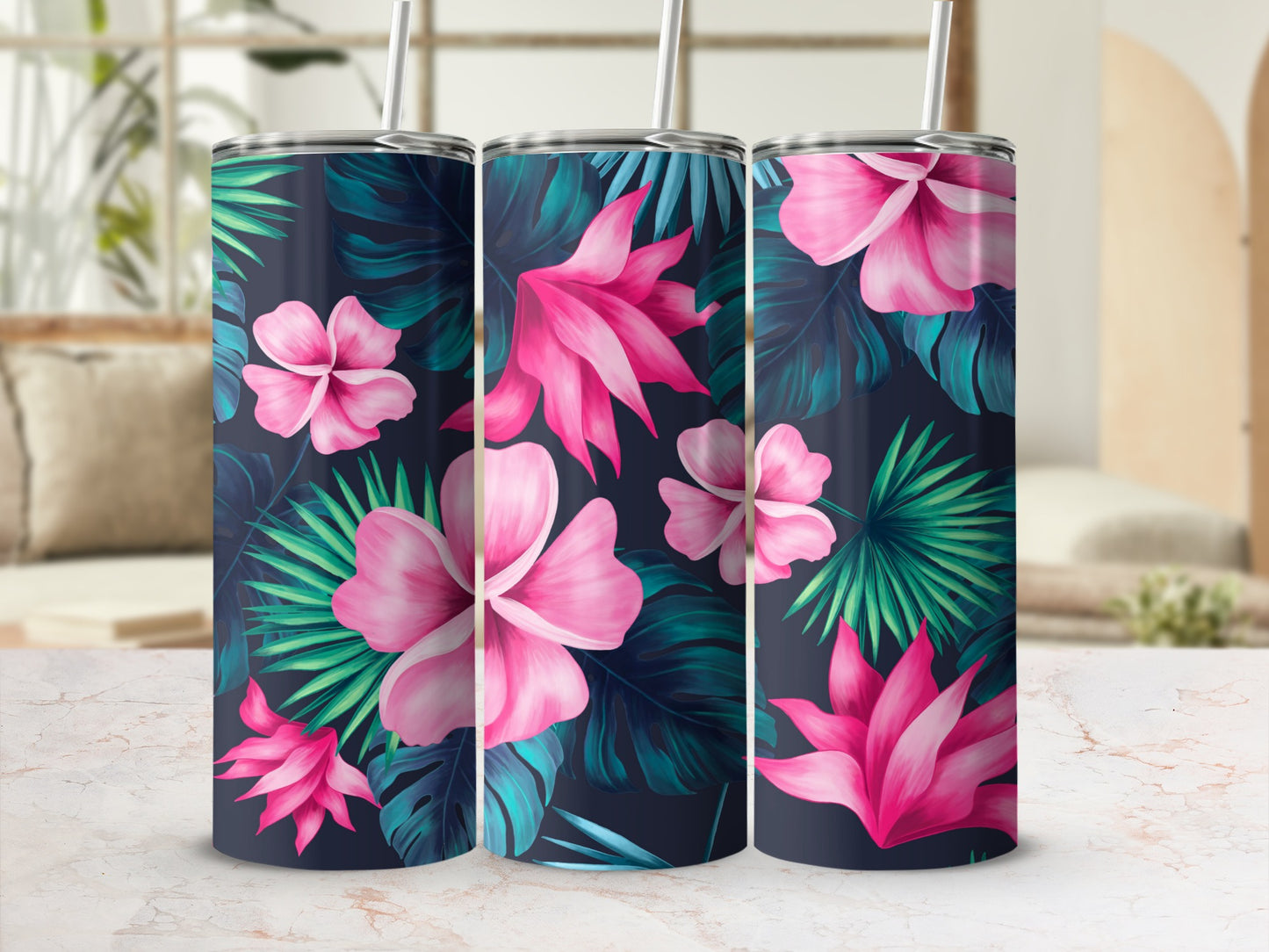 Three tumblers with pink hibiscus and palm leaves on dark background.