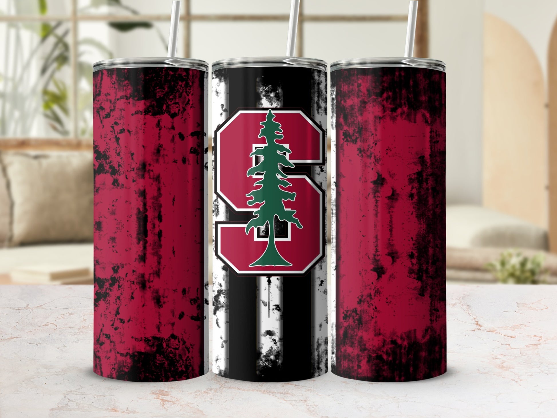 Three tumblers with distressed red and black wrap and a center tumbler with Stanford logo.