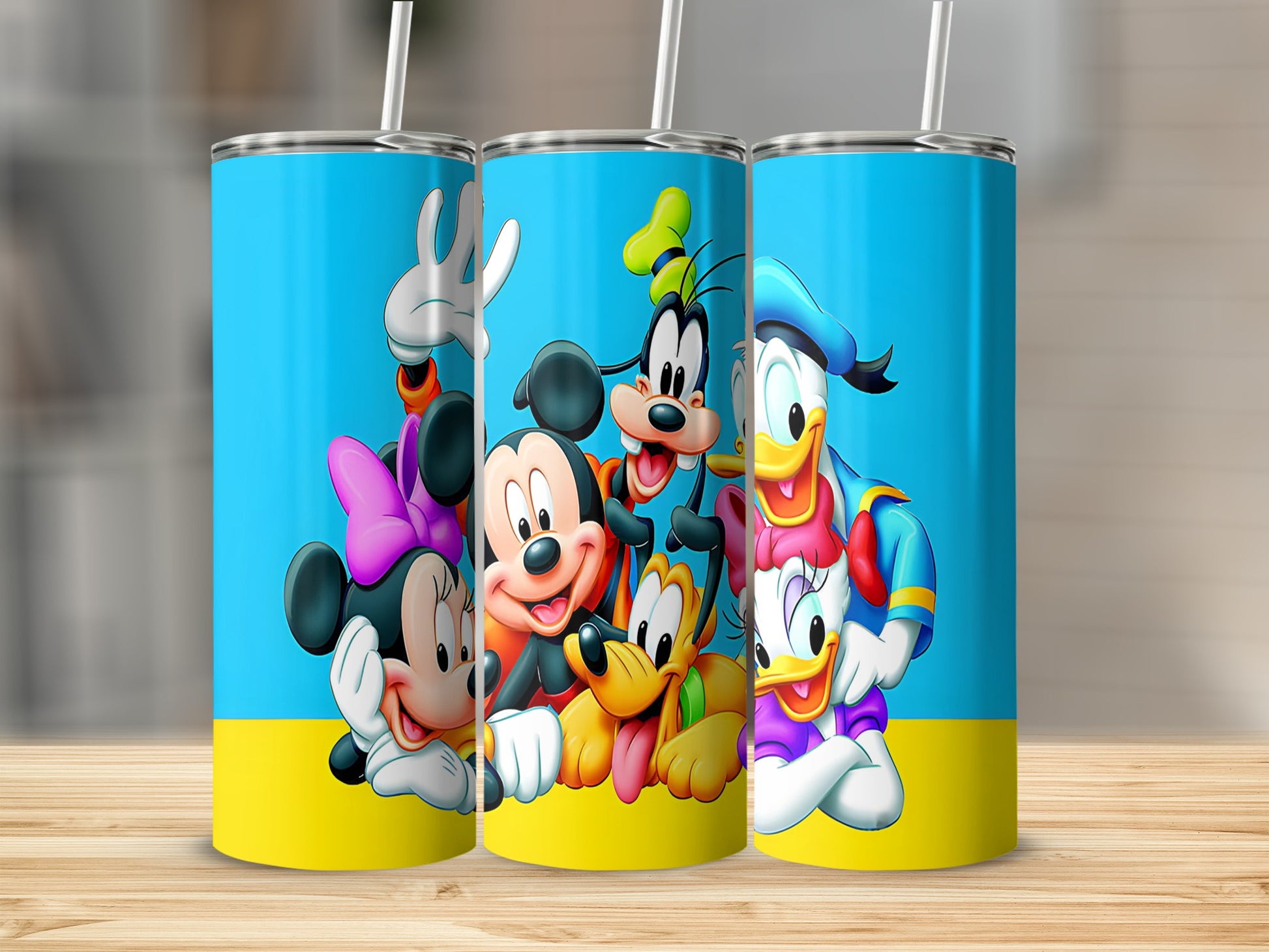 Mickey Mouse, Minnie Mouse, Goofy, Pluto, and Donald Duck on a blue and yellow tumbler.