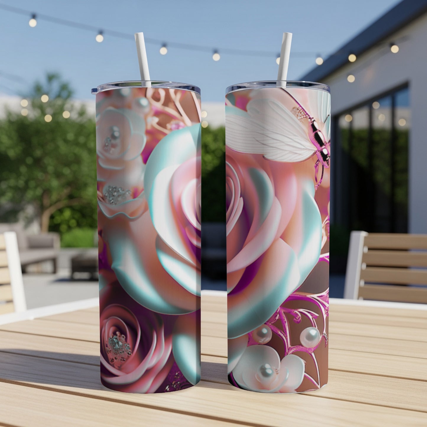Two tumblers with a butterfly and rose design on a wooden table.