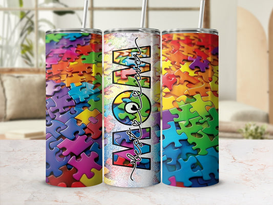 Three tumblers with colorful puzzle piece design and "Mom" text.