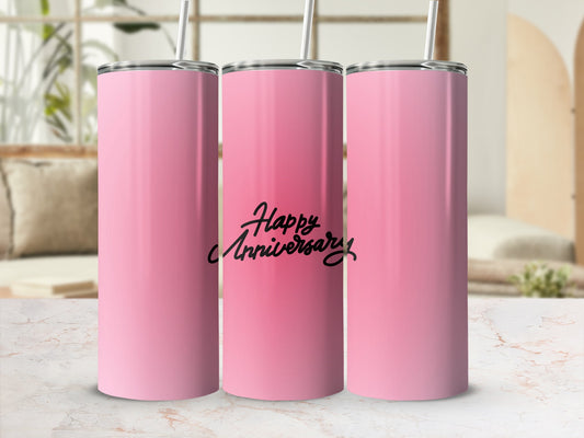 Pink tumbler with "Happy Anniversary" text and straw.
