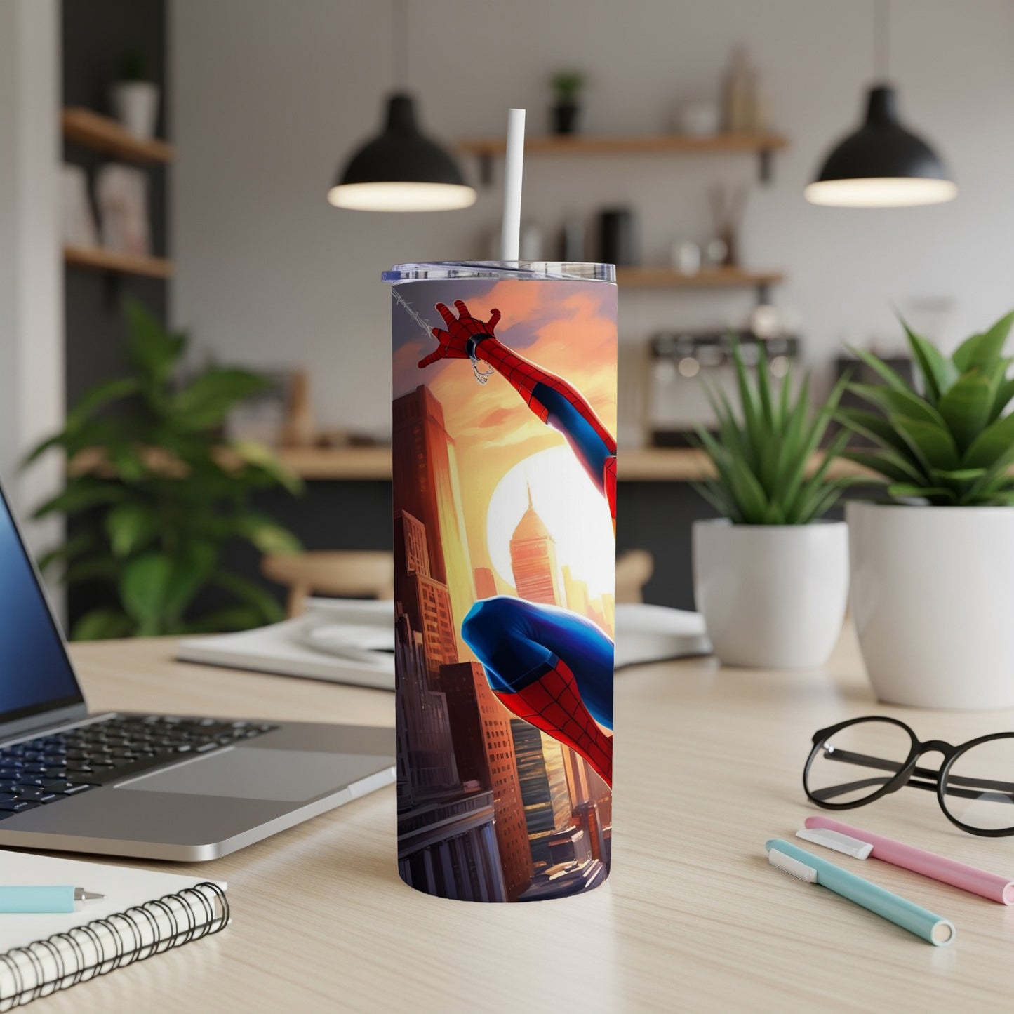Spider-Man on a city skyline at sunset, on a stainless steel tumbler.